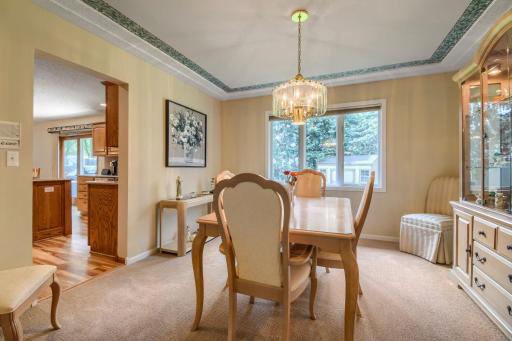 Separate formal dining room with a large window overlooking the backyard and plenty of space for entertaining.