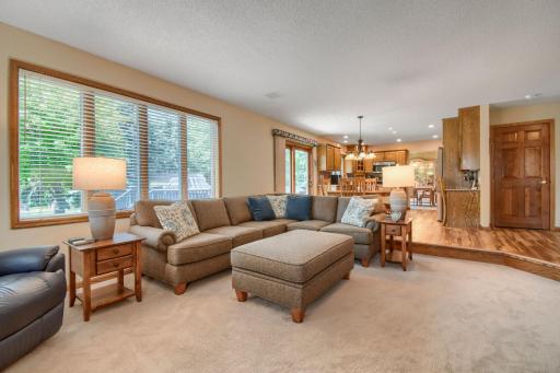 Step down into this family room off of the kitchen,