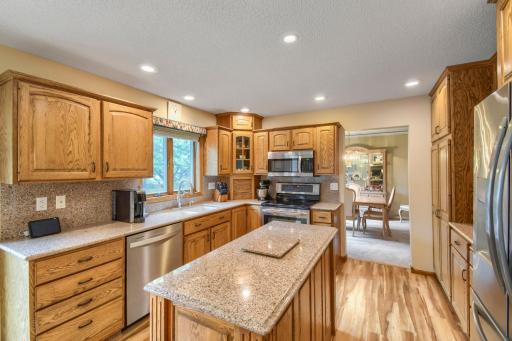 Quartz countertops by Cambria throughout as well as stainless steel appliances.