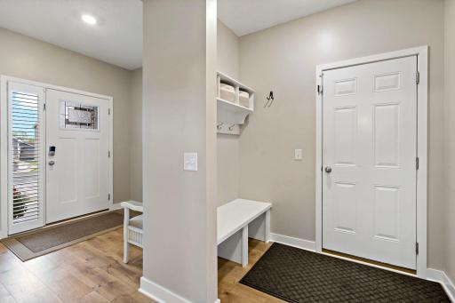 Easy garage access with drop zone and coat closet for the family.