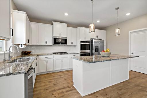 Beautile kitchen features a double oven and large walk-in pantry!