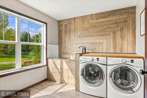 Upper-level Laundry with pet washing station.