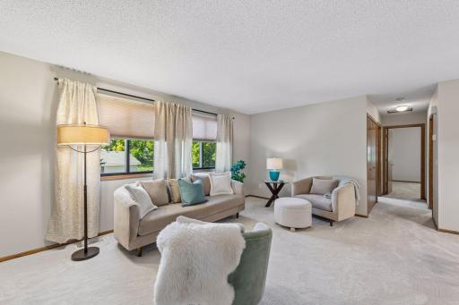 Afternoon sunshine and evening sunsets bring warmth to the living roomâa welcoming spot to settle in with a book or catch up with friends.