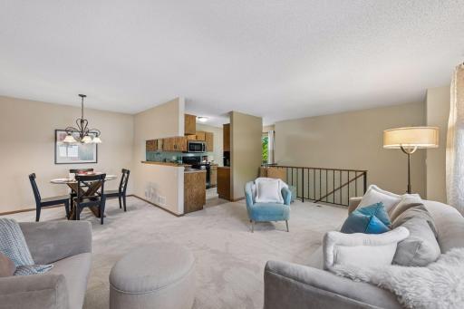 From a relaxed evening on the sofa to dinner with friends, the connected living and dining spaces keep everyone close, with a convenient pass-through to the kitchen.