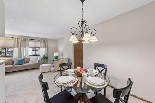 Let the conversation linger after dinnerâthe dining area opens directly into the inviting living room, keeping gatherings comfortably connected.