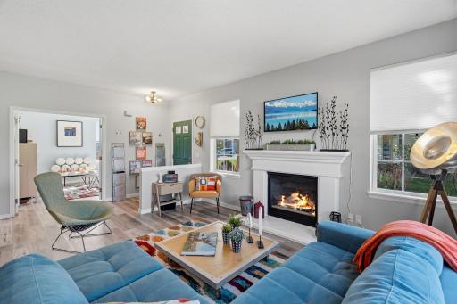 Cozy gas fireplace provides warmth and the windows provide abundant natural light.