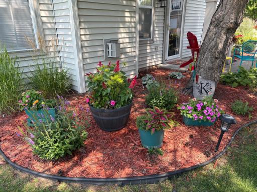 Decorate your home with perennials and potted flowers. (Flowers at 8967 Comstock provided by seller)