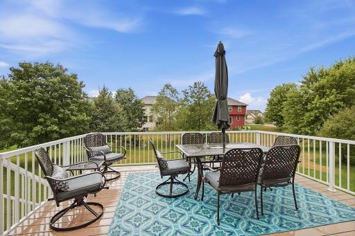 Roomy maintenance free deck with stairs to the big back yard.