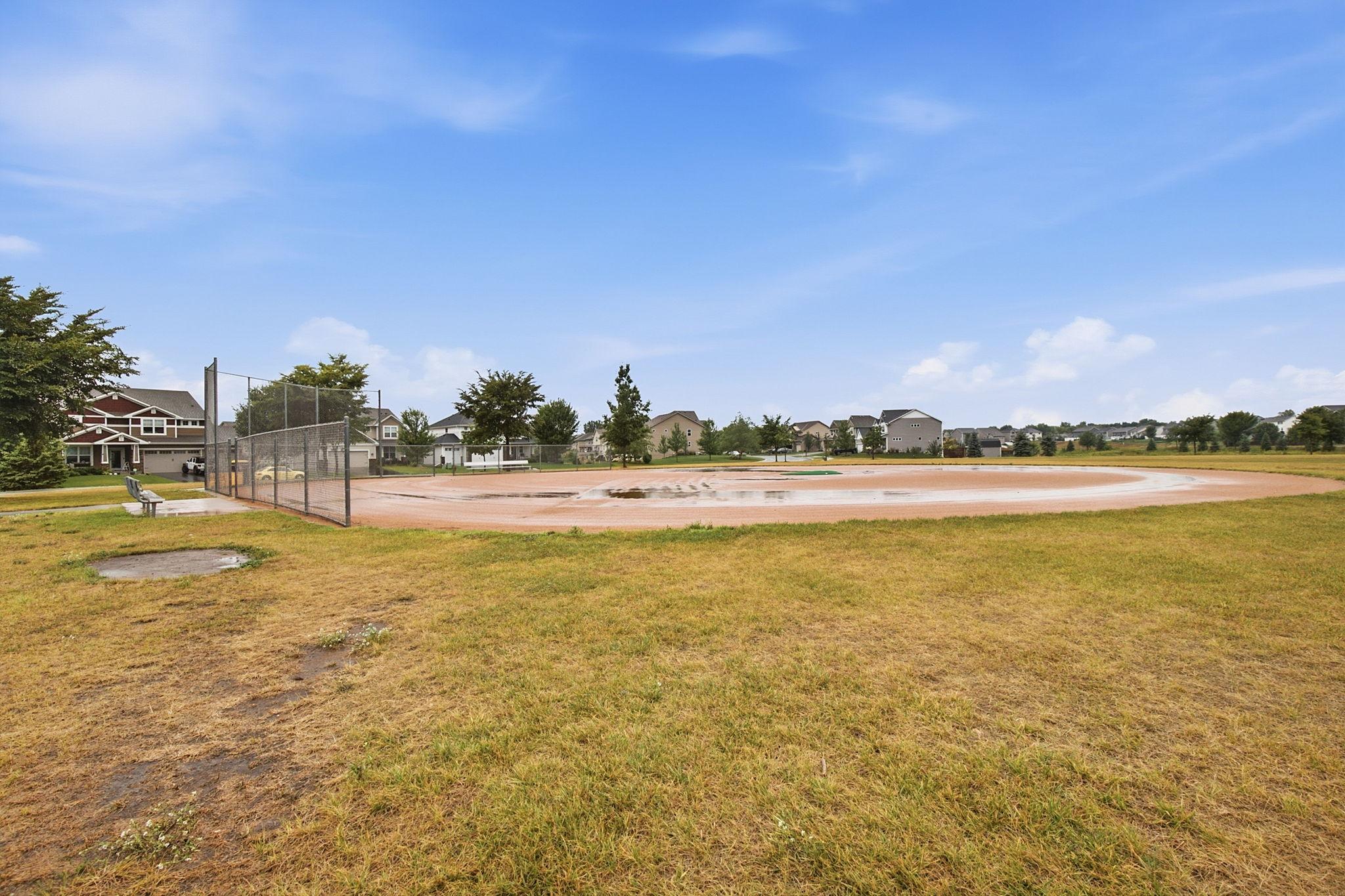 Neighborhood ball field and pickle ball court.