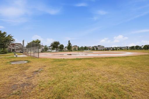 Neighborhood ball field and pickle ball court.