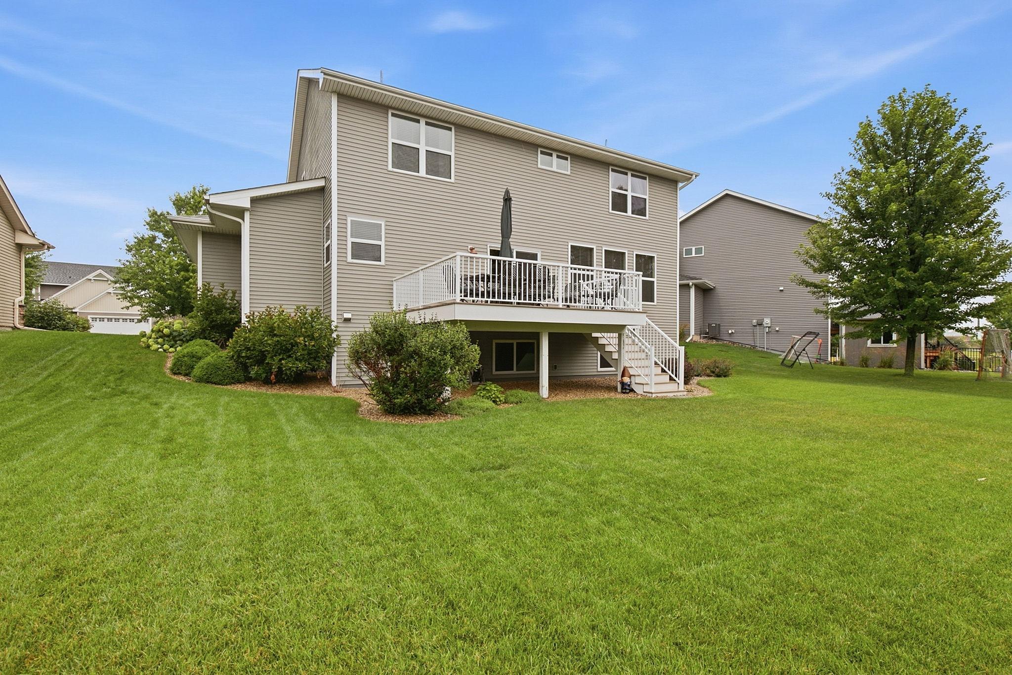 View to the back of home with large maintenance free deck.