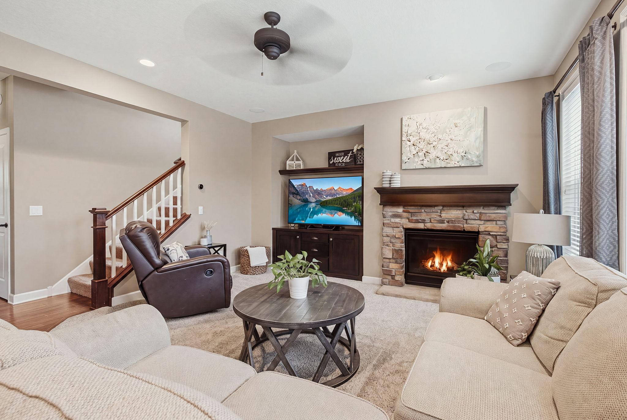 Built in cabinets, ceiling fan, surround sound speakers and cozy gas fireplace.