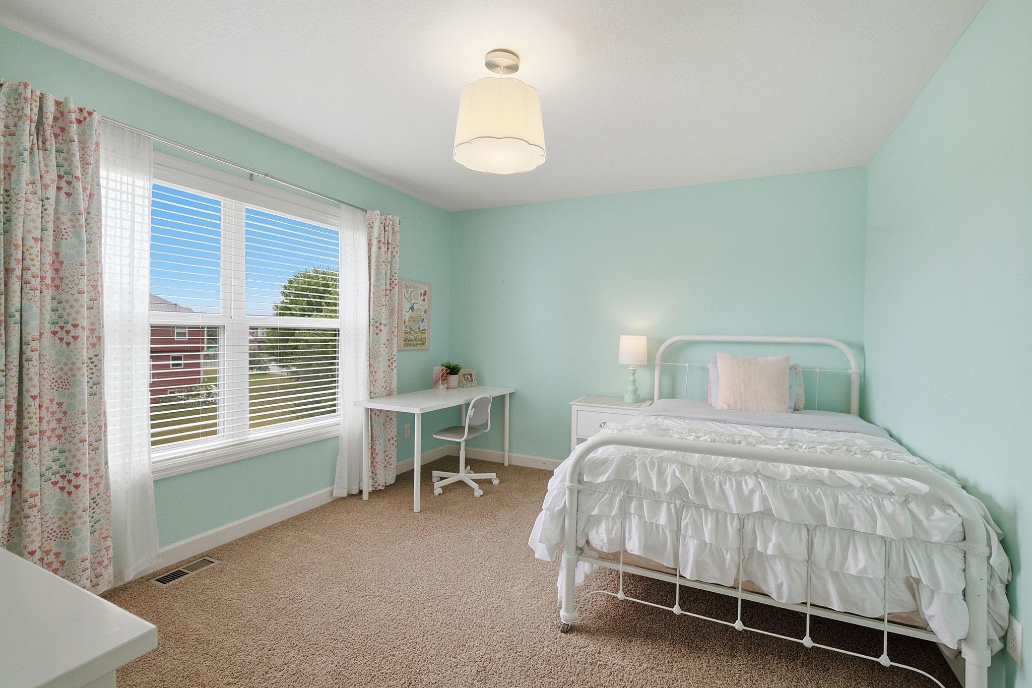 Upper-bedroom features updated lighting, and large sunny window