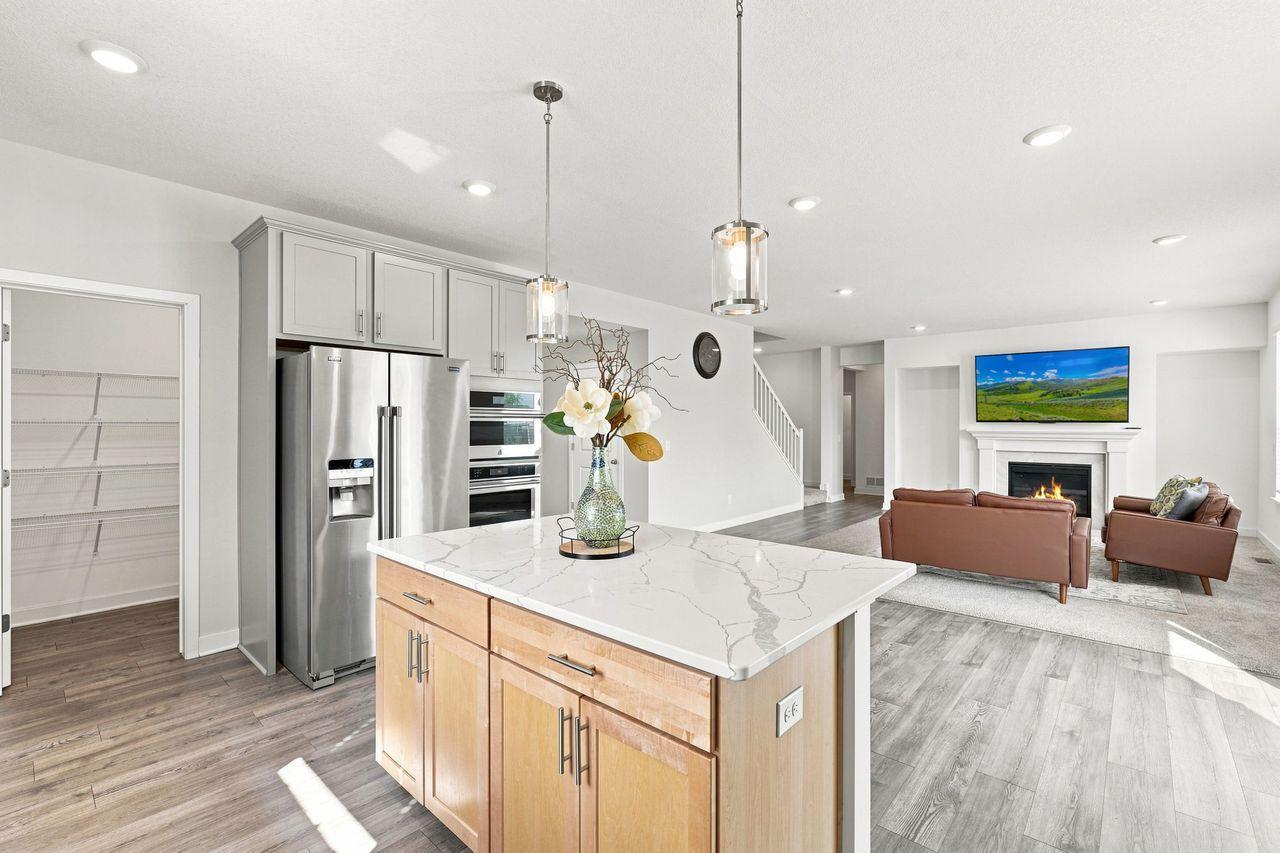 Open concept kitchen looks to the main level family room