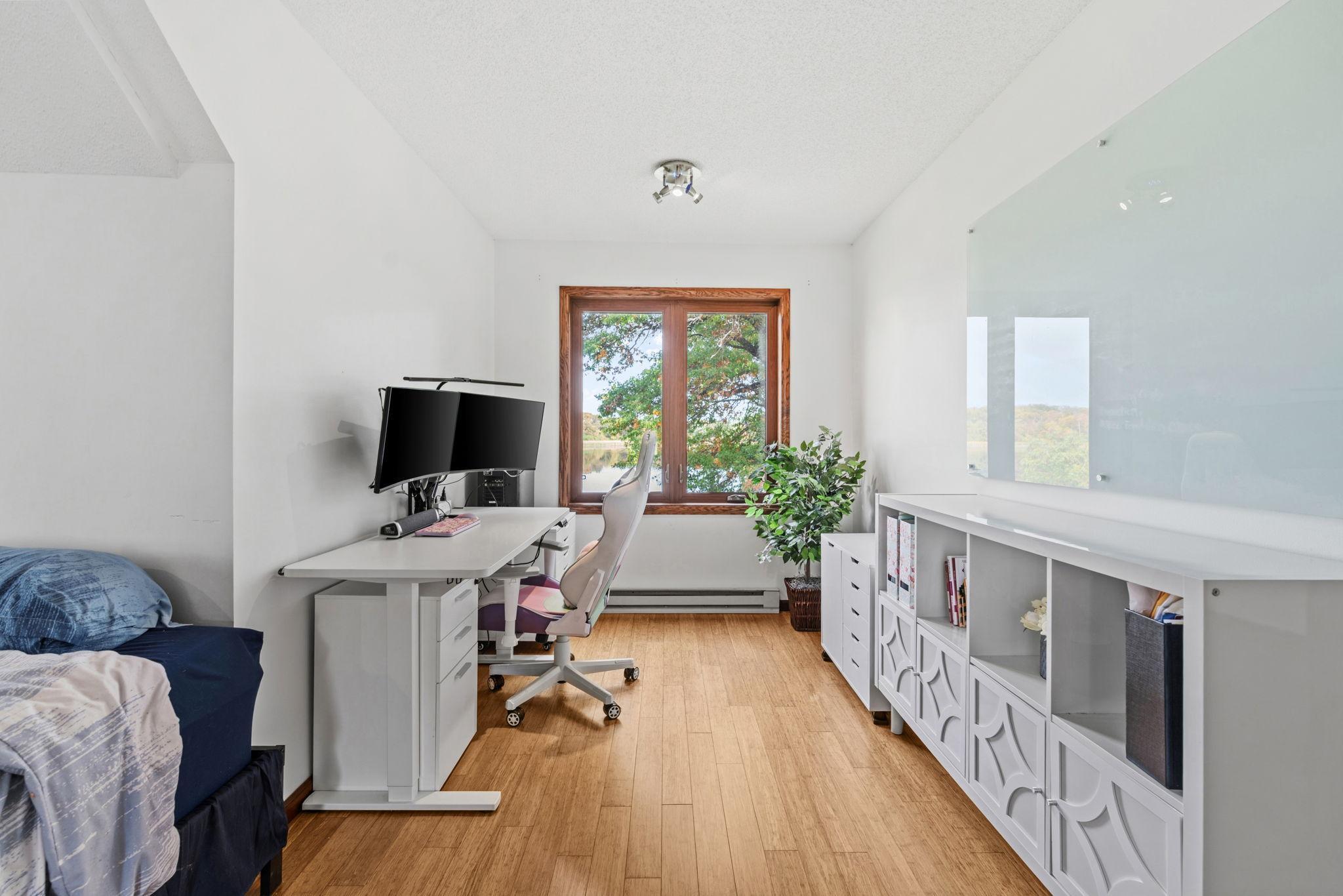 One bedroom is a unique bonus room above the garage, complete with a walk-in closet, large windows, and its own heat source.