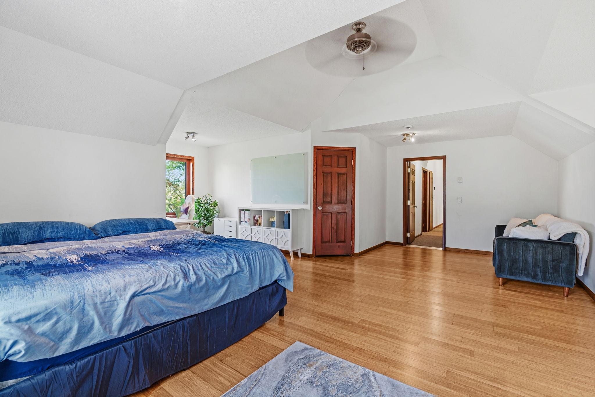 One bedroom is a unique bonus room above the garage, complete with a walk-in closet, large windows, and its own heat source.