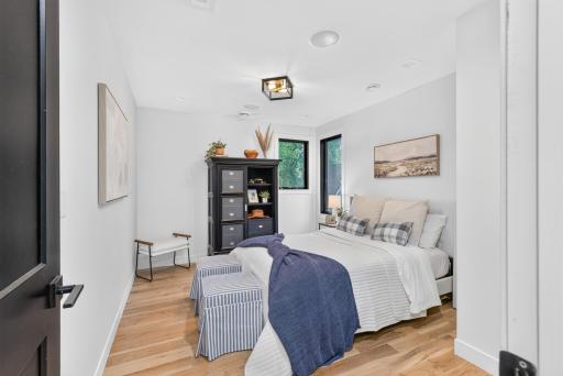 3rd bedroom on upper level features hardwood floors and neutral finishes