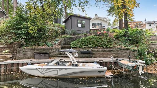 Channel-side view highlighting the propertyâs waterfront setting, private dock with direct water access.