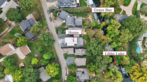Aerial view showing the homeâs unique location between Grays Bay and Libbs Lake, with channel access connecting to both bodies of water.