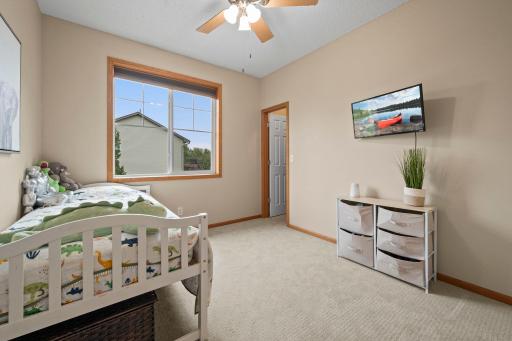 The third main level bedroom provides flexibility for a bedroom, nursery or home office.