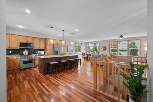 Hardwood floors and an open layout connect the kitchen, dining area and great room for easy everyday living.
