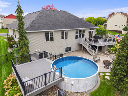 Enjoy summer days in the above ground pool with an adjoining deck for lounging.
