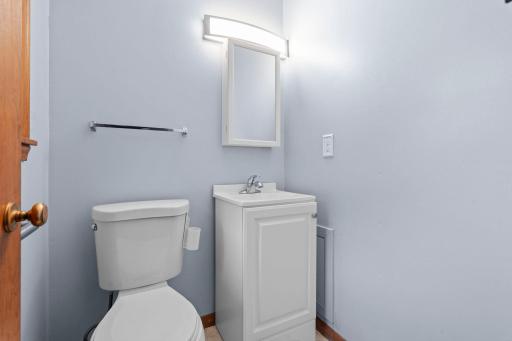 The primary suite includes its own private half bath