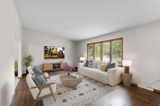 The large living room offers abundant natural light and plenty of space for comfortable everyday living *This photo has been virtually staged