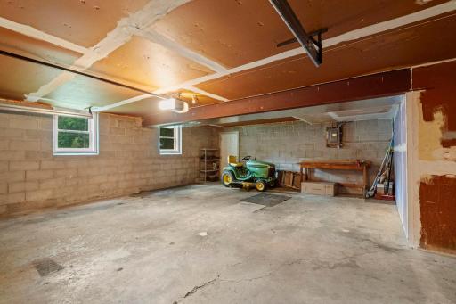 The extra deep, oversized garage provides an impressive amount of space for parking, storage, a workshop, or recreational gear