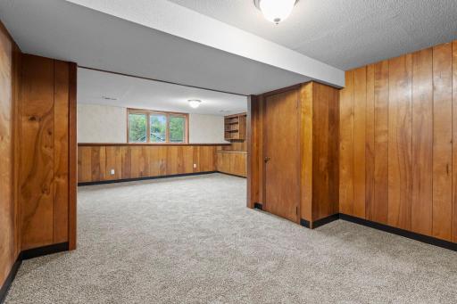 The expansive lower-level family room offers plenty of flexibility for multiple seating areas, a game space, or whatever best fits your lifestyle