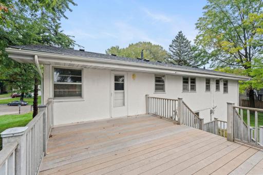 Relax or entertain on the large deck overlooking the beautiful backyard, with plenty of room to enjoy the outdoors