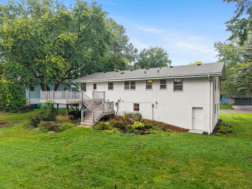 Established landscaping adds charm around the home, while a convenient access door from the garage leads directly to the backyard