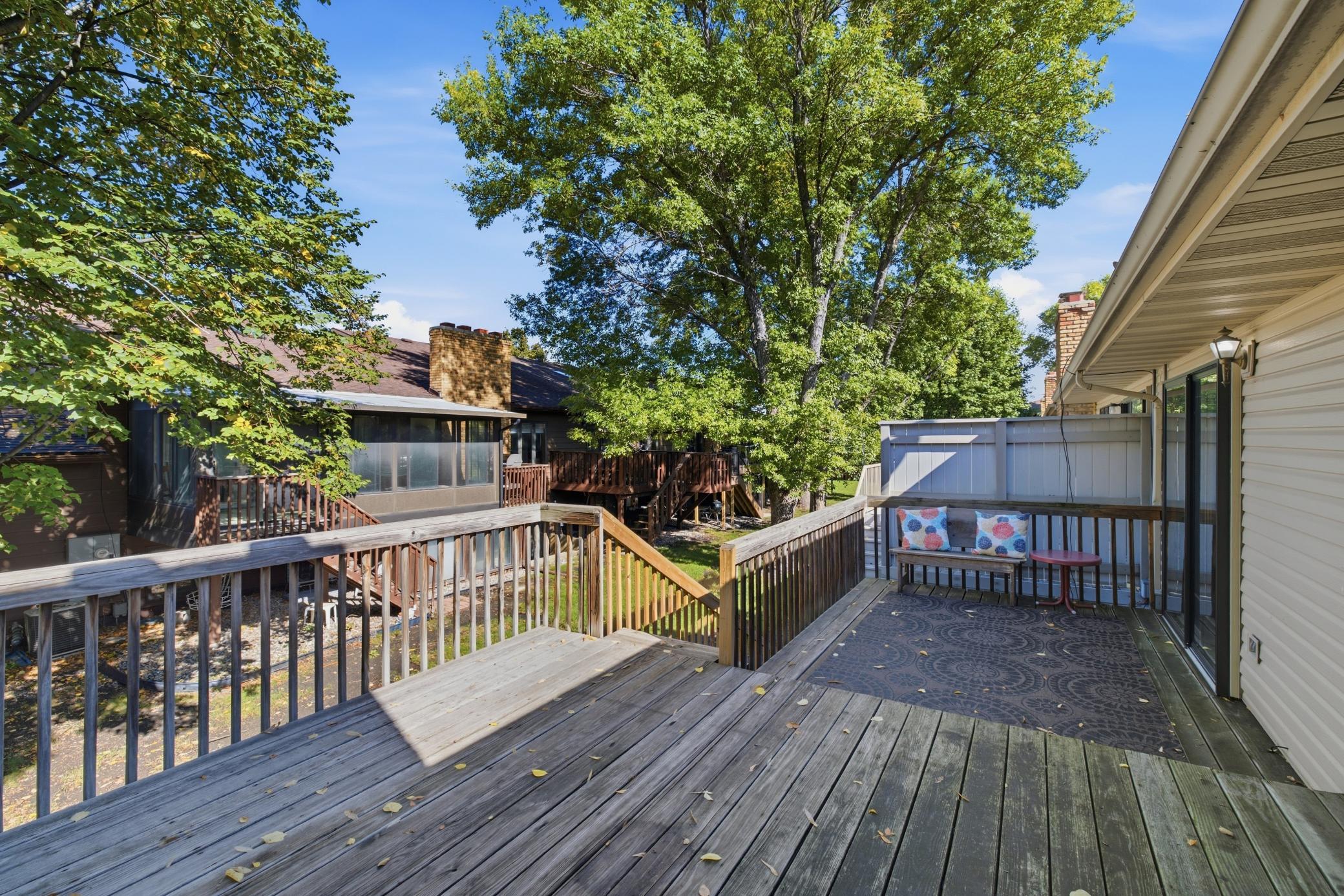 Wood deck overlooking yard and green space