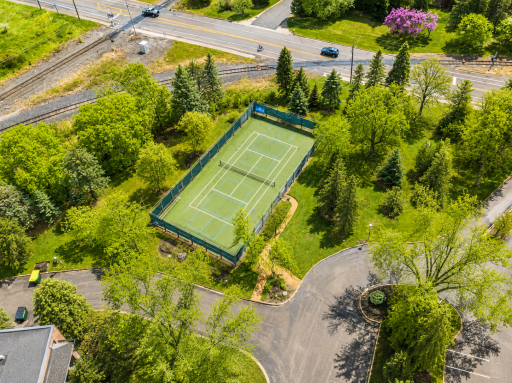 Outdoor recreation continues with private tennis and pickleball courts, along with guest parking.