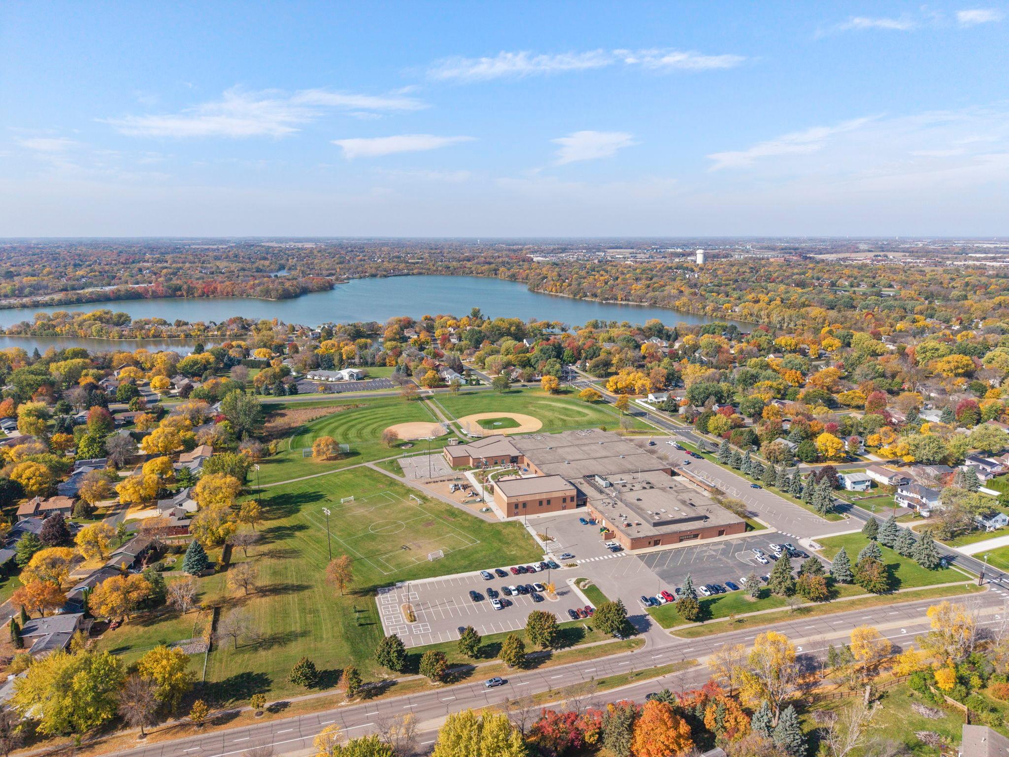 Additional highlights include comfortable living spaces, a peaceful cul-de-sac setting, and a convenient location close to shopping, parks, walking and biking trails, and Rice Lake.