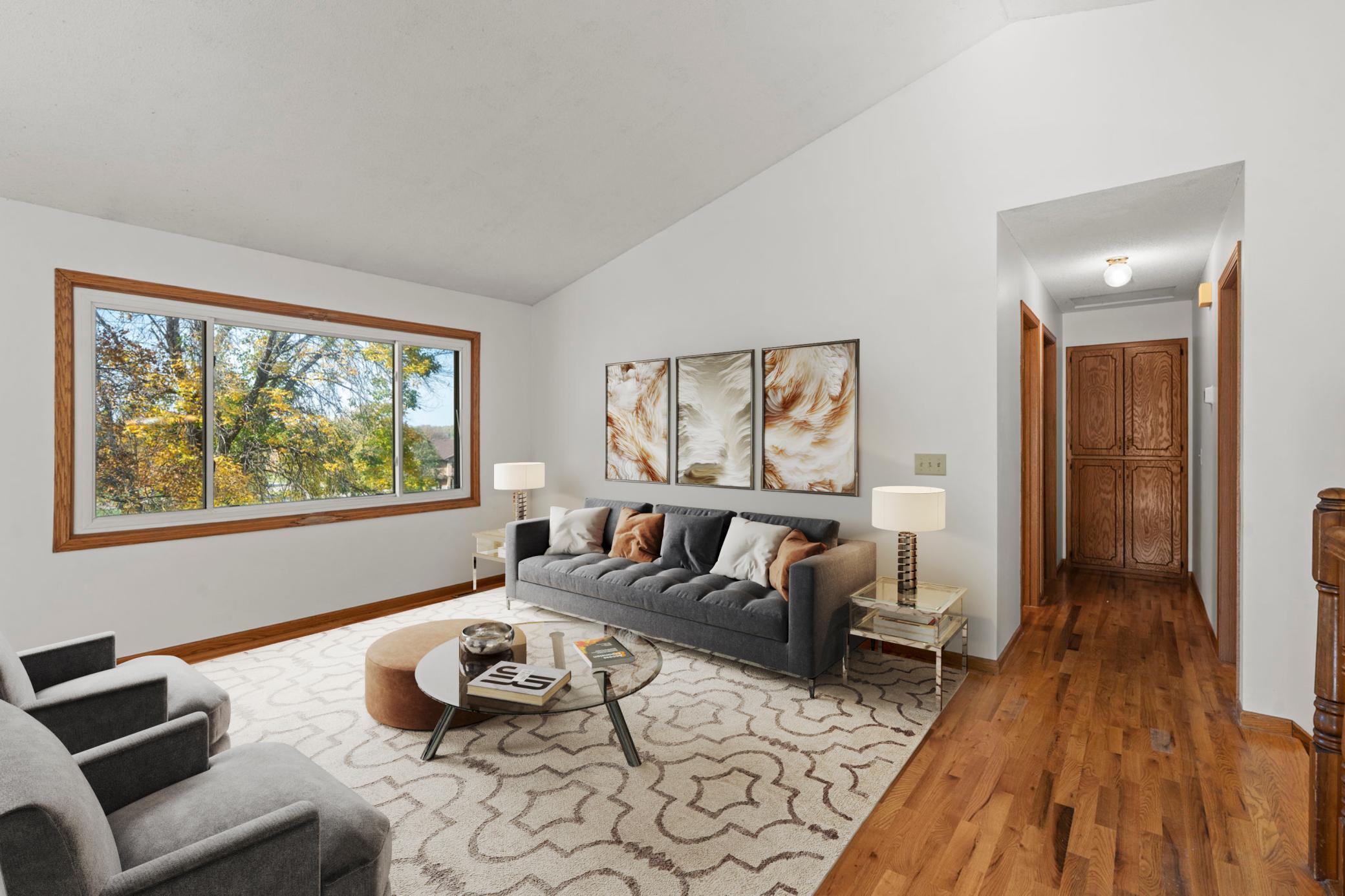 Living room with an abundance of natural light (virtually staged).
