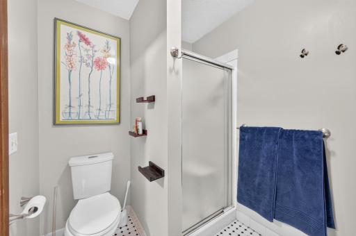 Enjoy the private ensuite 3/4 bathroom with tiled floors