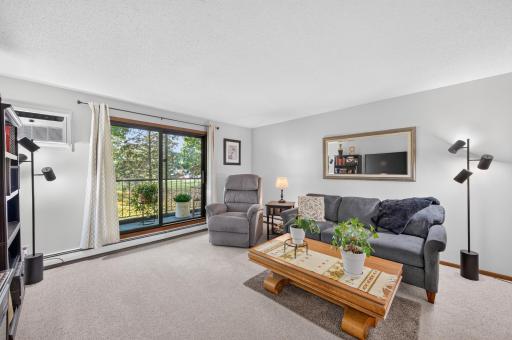 Spacious family room with views of the wooded backyard.