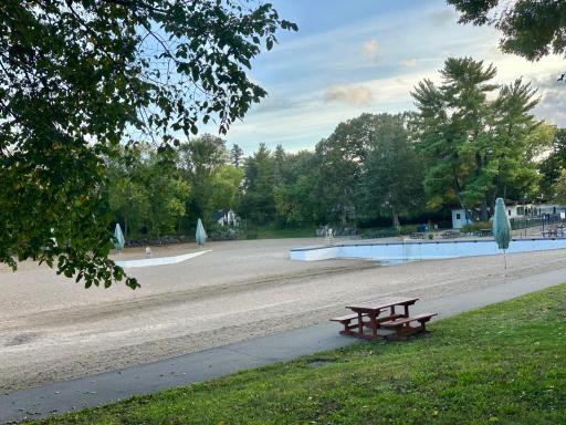 The pool is currently drained but get ready to enjoy the sand bottom pool!