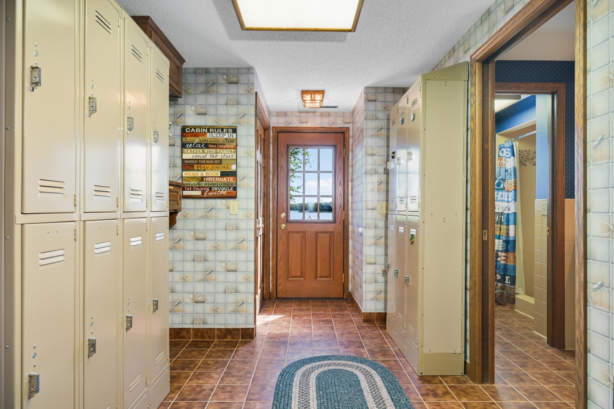 Lakeside locker room with 12 lockers, two lighted dressing stations and direct patio access.