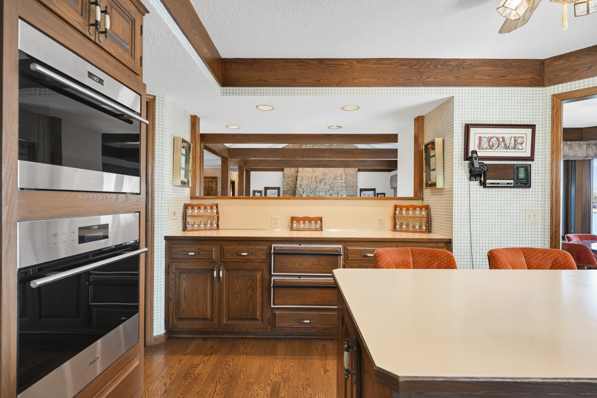An open pass-through keeps the kitchen connected to the living room and its lakeside views.