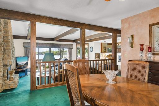 From dining to living, the lake remains part of the backdrop throughout the main level.