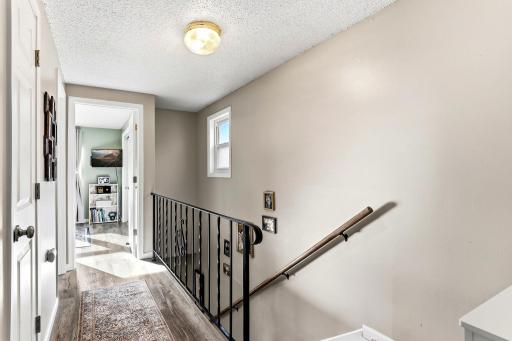 LVP flooring continues through the upstairs hallway, helping create a clean and updated look.