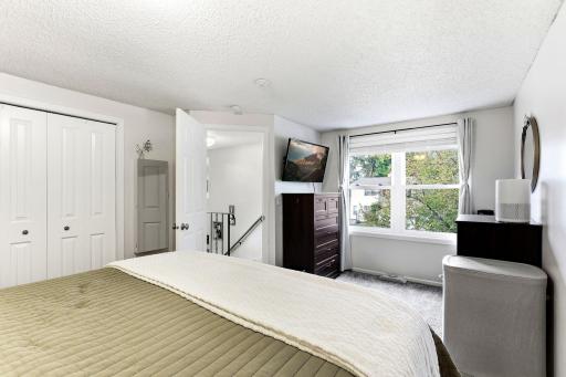 New Carpet (2025), white trim and New Closet Doors (2026) give the Owner's Bedroom a fresh, updated look.