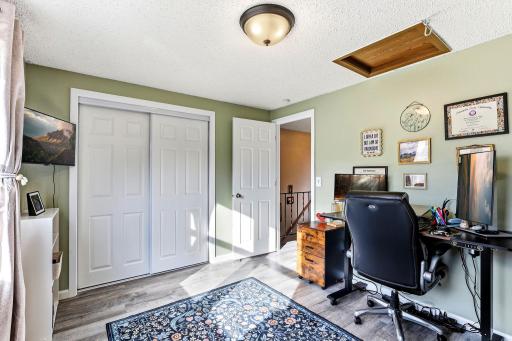 This versatile second Bedroom is currently set up as a home office and offers a large window, LVP flooring and plenty of natural light.