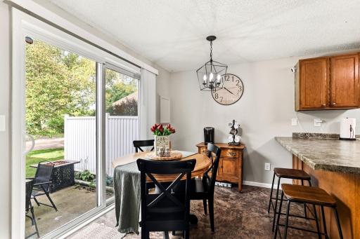 Dining area with plenty of room for a table plus a large sliding glass door leading directly to the private patio.