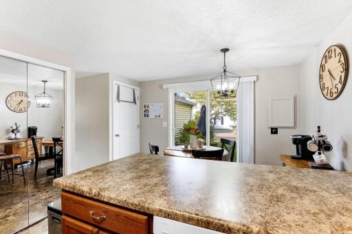 The large peninsula adds valuable counter space while keeping the Kitchen open to the adjoining Dining area and patio.