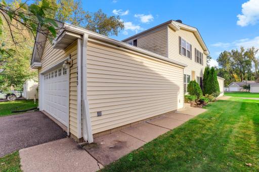 End-unit location provides a little extra breathing room, with a sidewalk leading along the side of the garage to the front entrance.