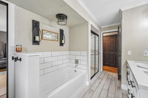 Main floor bathroom with separate tub and shower
