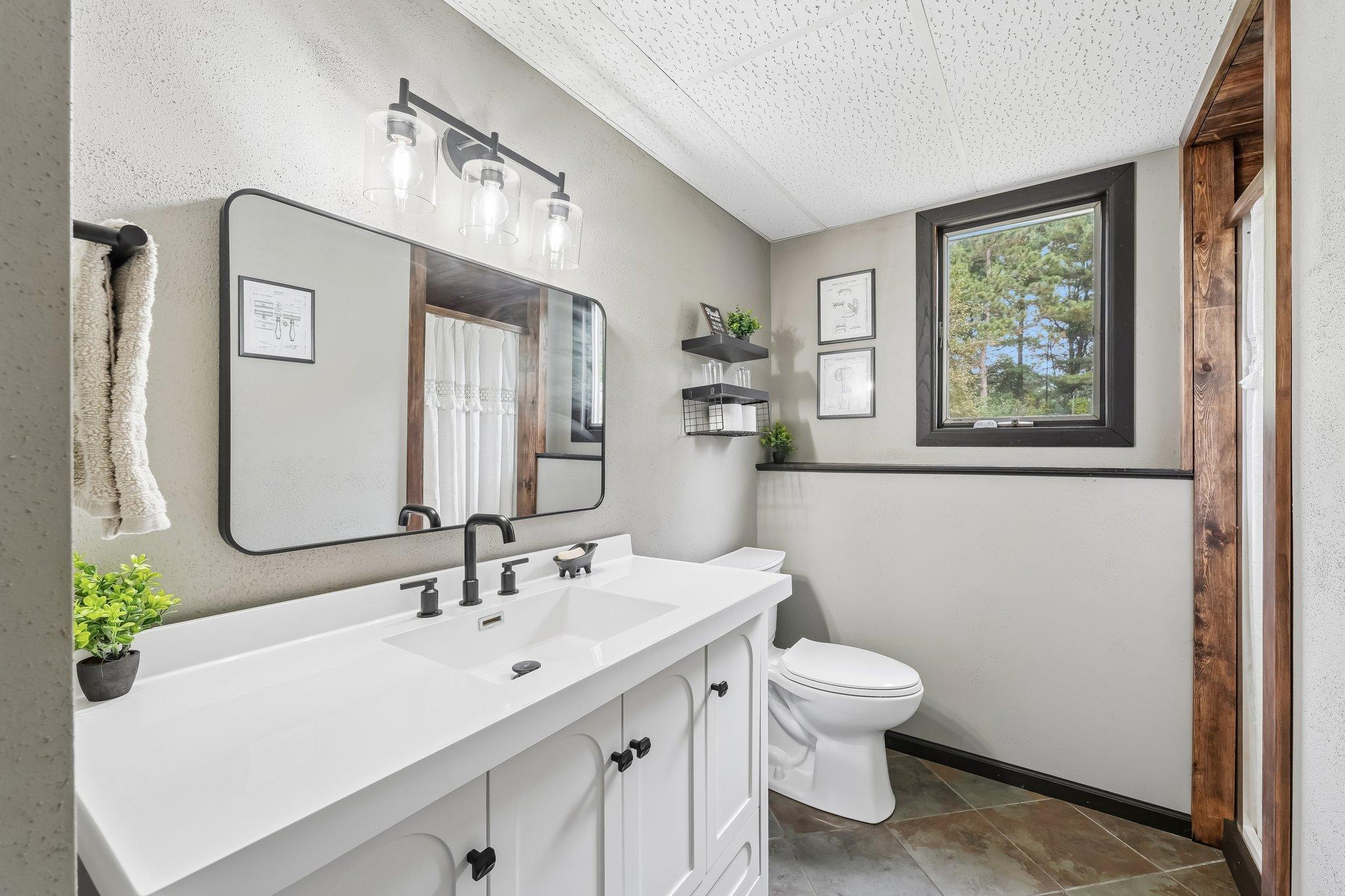 Lower level 3/4 bathroom with shower